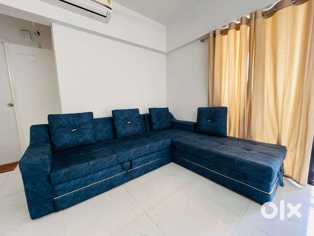 L shaped sofa cum bed with storage space