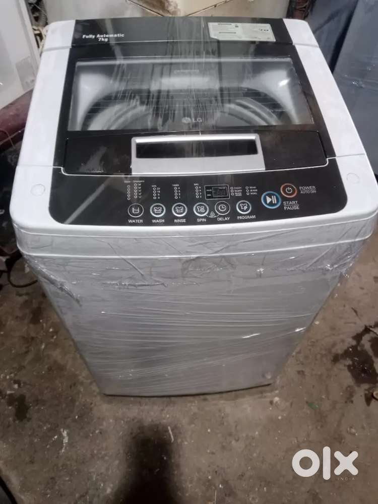 LG washing machine fully automatic top load with warranty 1 year old