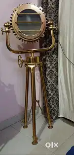 A nautical, modern, studio, floor lamp as a tripod floor lamp