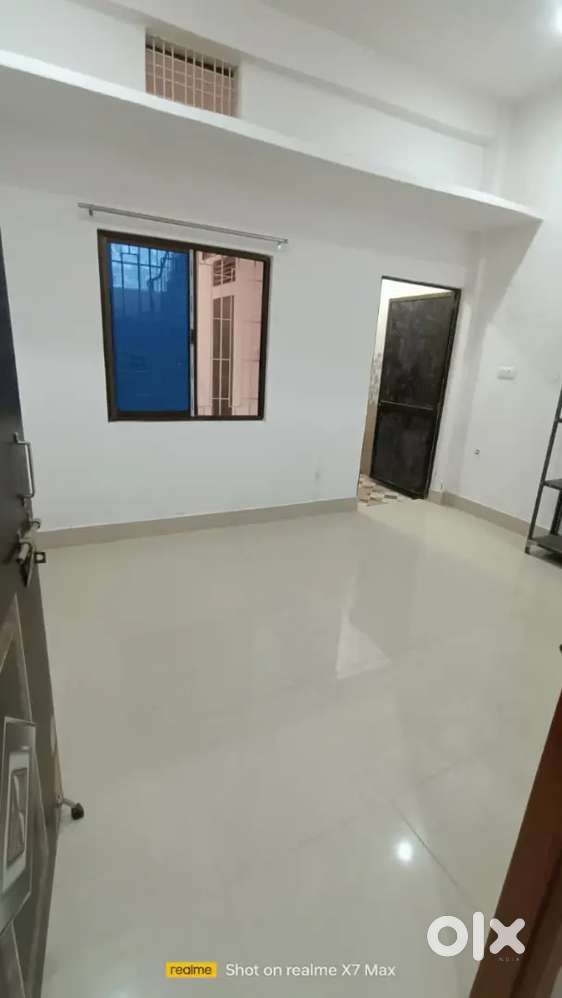 Compact room with attached bathroom and kitchen for family