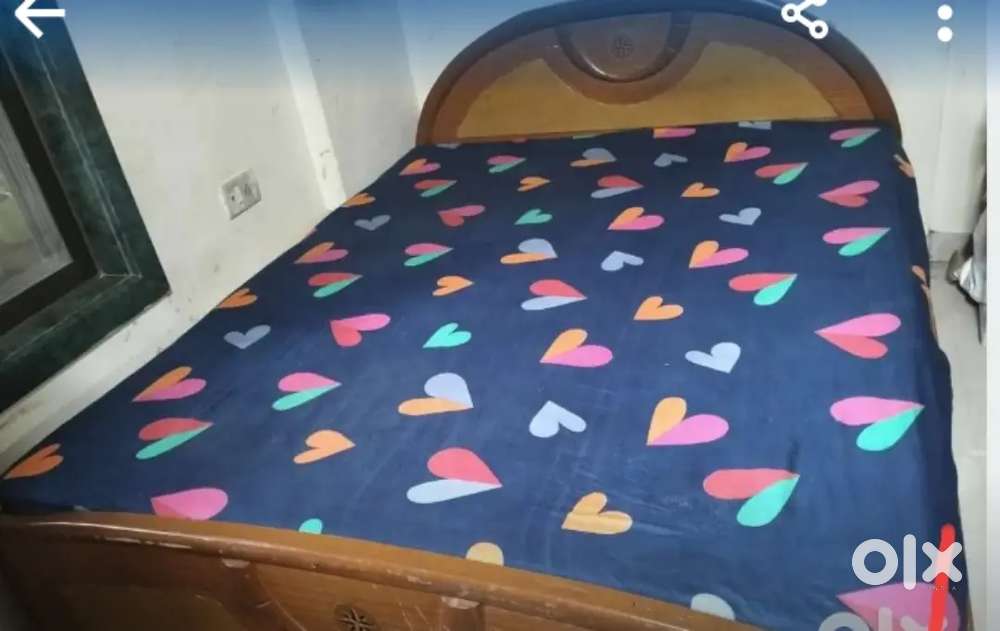 Queen size double wooden bed of strong and good quality.