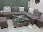 L shape Sofa with center table, cushions and 2 Puffy