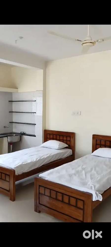 Fully furnished room with bed almiraytable chair geyser