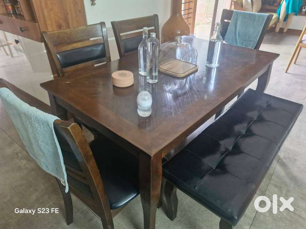 Dining Table with 4 Chairs and one cushion sofa