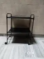 Multipurpose revolving trolley made of iron pipe with two glass shelvs