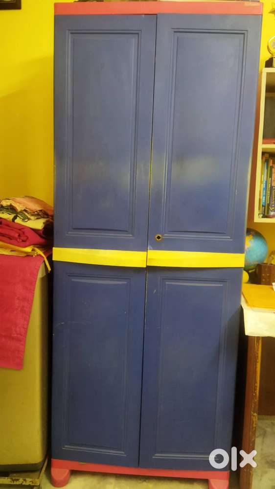 Wardrobe, single bed with storage and utensils rack