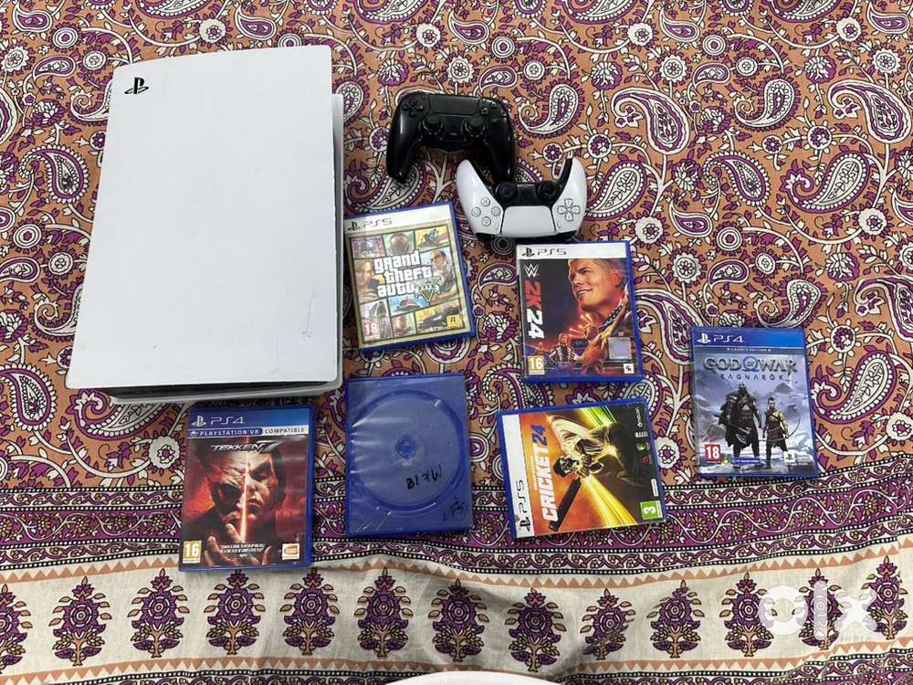 A brand-new PS5 with two controllers with box and six disc