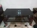 Black glass table with wheels