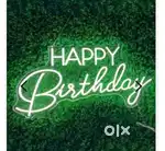 Happy birthday neon light and beautiful plants for cafe and home decor