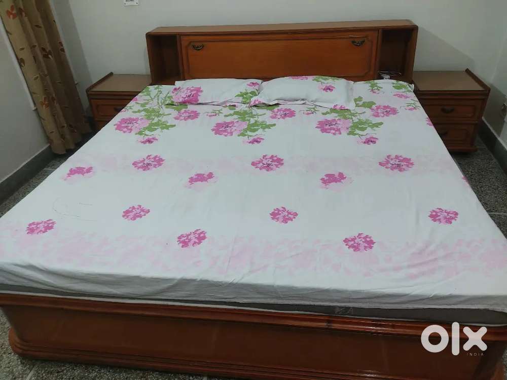 Double bed with side table drawers
