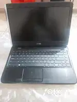 A dell laptop with a wired mouse