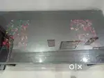 Wooden Center Table with Glass Top

Good Condition