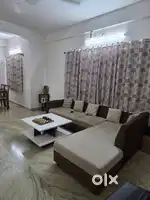 L-shaped sofa with centre table
