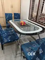 Glass top dining table with 6 chairs.very good condition