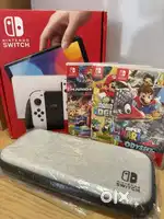 Nintendo Switch OLED model bundle inc SEVEN games & case, mint, A