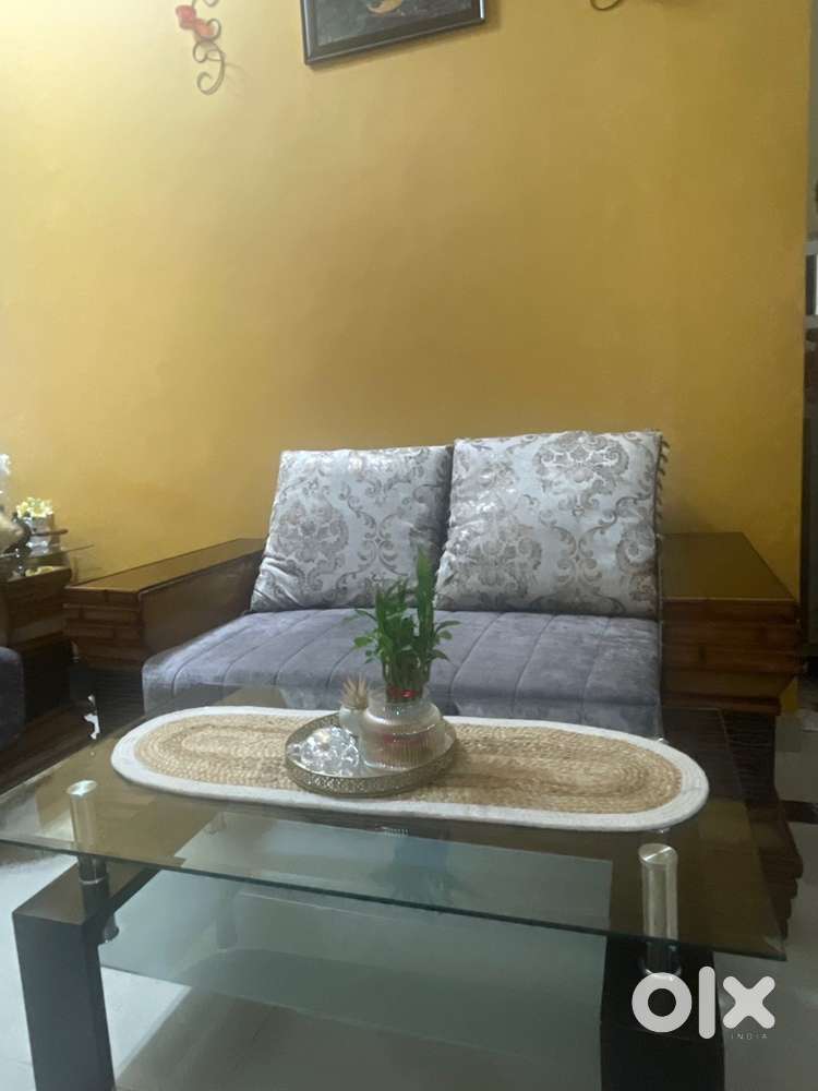 Solid wooden polished sofas with centre table
