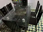 Glass top 6-seater wooden dining table