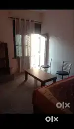 One room with double bed nd chair kitchen nhi haj