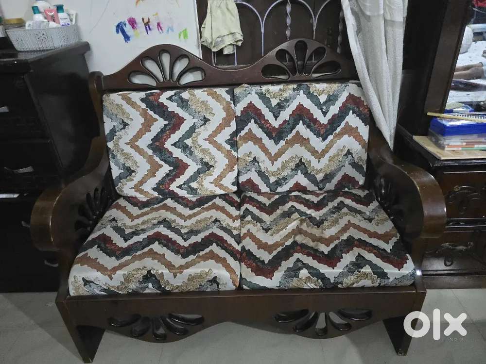 2 two seater and 1 one seater with a tea table