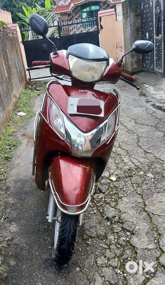 { Honda Activa 125cc } in  Rebel Red colour