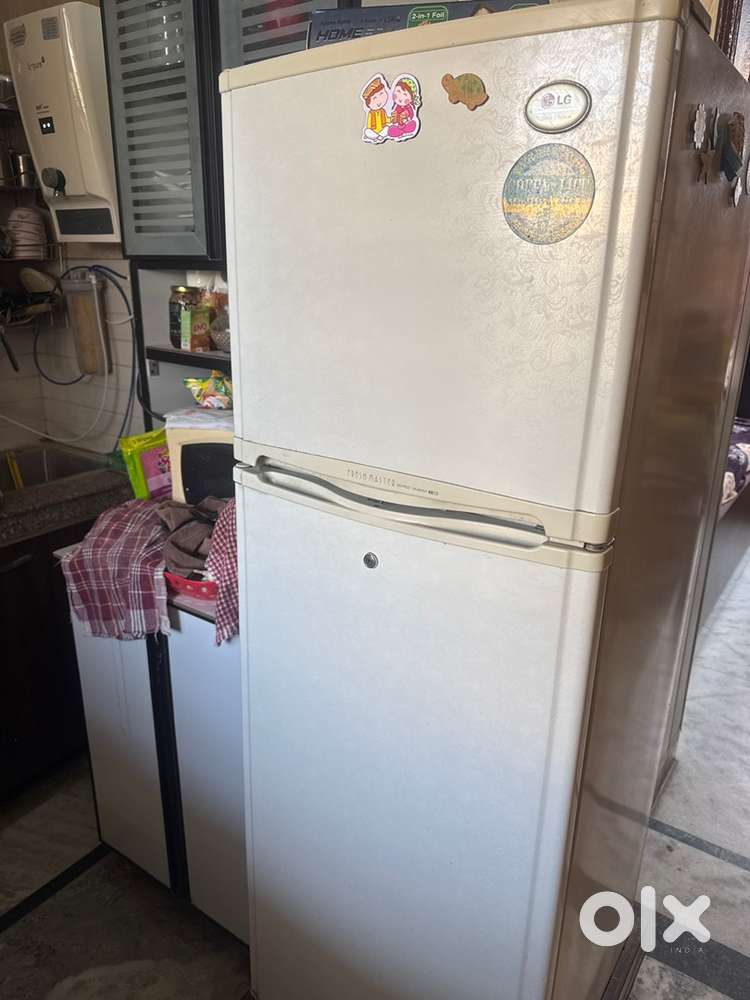 LG 280lt. Fridge wid wooden base stand, new compressor installed,
