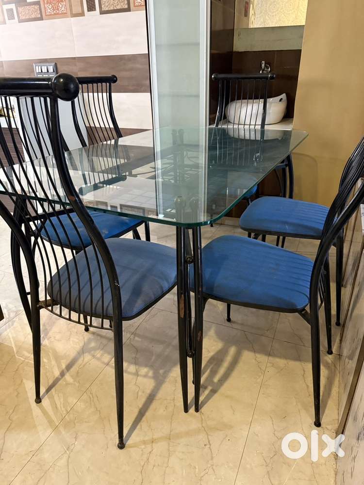Metal dining table with glass
