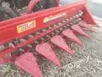 Tractor mounted reaper