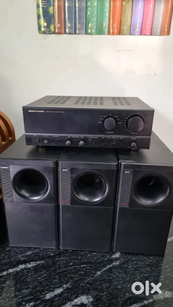 Marantz Integrated stereo and three bose subwooferss