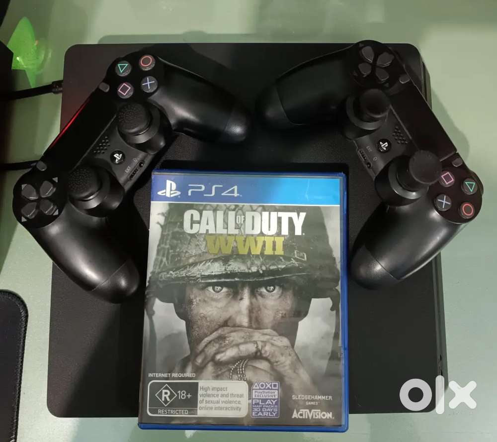 Ps4 slim 1 tb with 2 controller and 2 CDs and 10 games