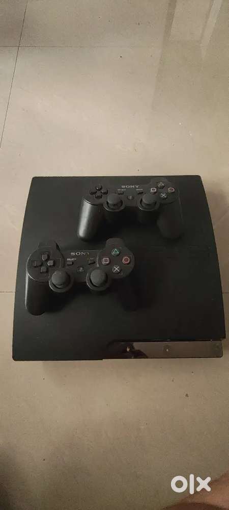 PS3 Slim console with 2 original controller