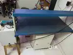Steam ironing machine with table