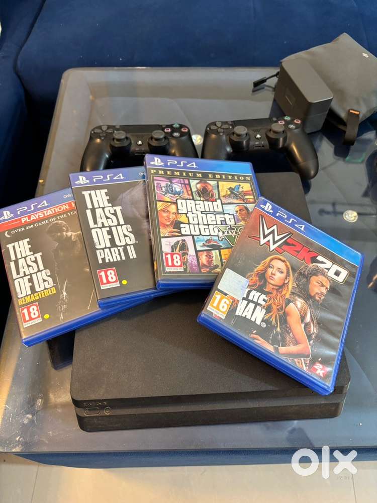 Ps4 slim 1 tb 2 controllers with 4 games