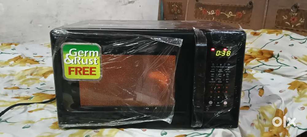 Microwave grill 1 year  25 litter old good working
