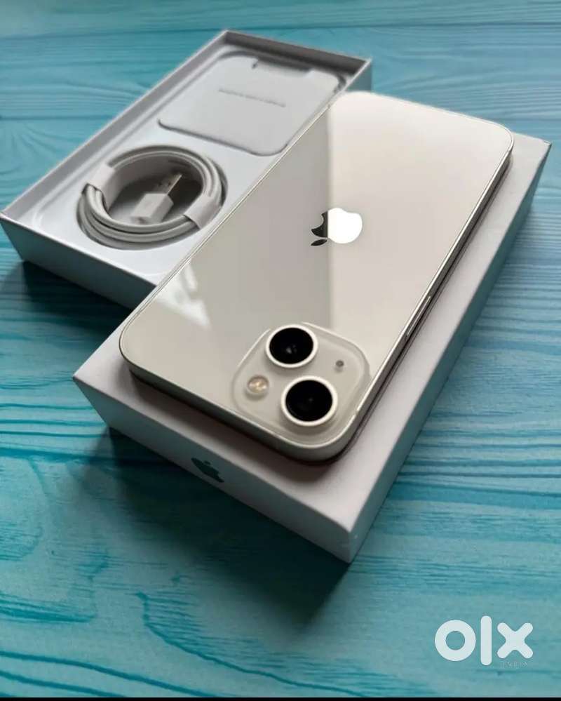 Selling my 4 months old I phone 13 in white colour Need urgent money