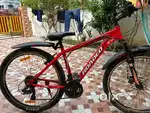 Almost new 26 in with Simano gears 21,  front suspension less used