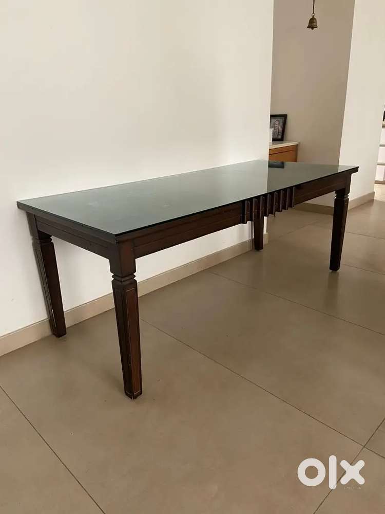 A glass top dining table
