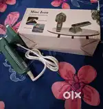 Mini iron with water spray function