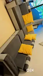 Gray L-shaped sofa, seats 6. Spacious and comfortable. Good condition.
