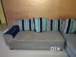 L shaped Couch blue and silver.