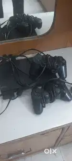Play station 2 with 2 controls and with 8gb memory card