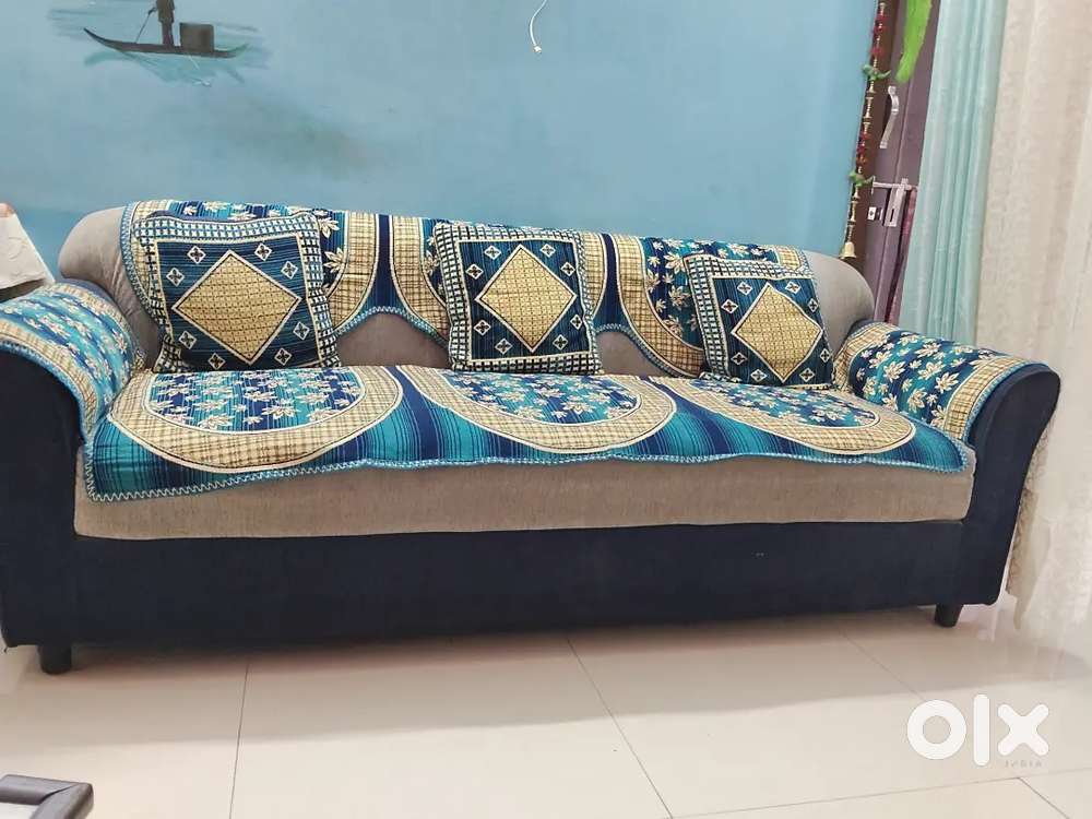 Blue and white coloured sofa