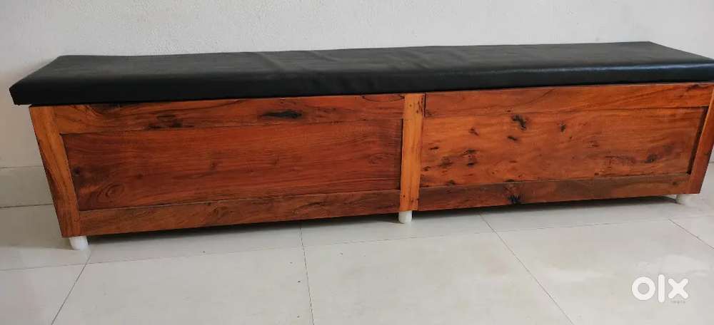Wooden storage bench with cushioned top