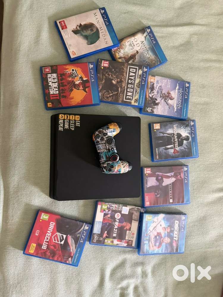 PS4 console with one controller and 10 games