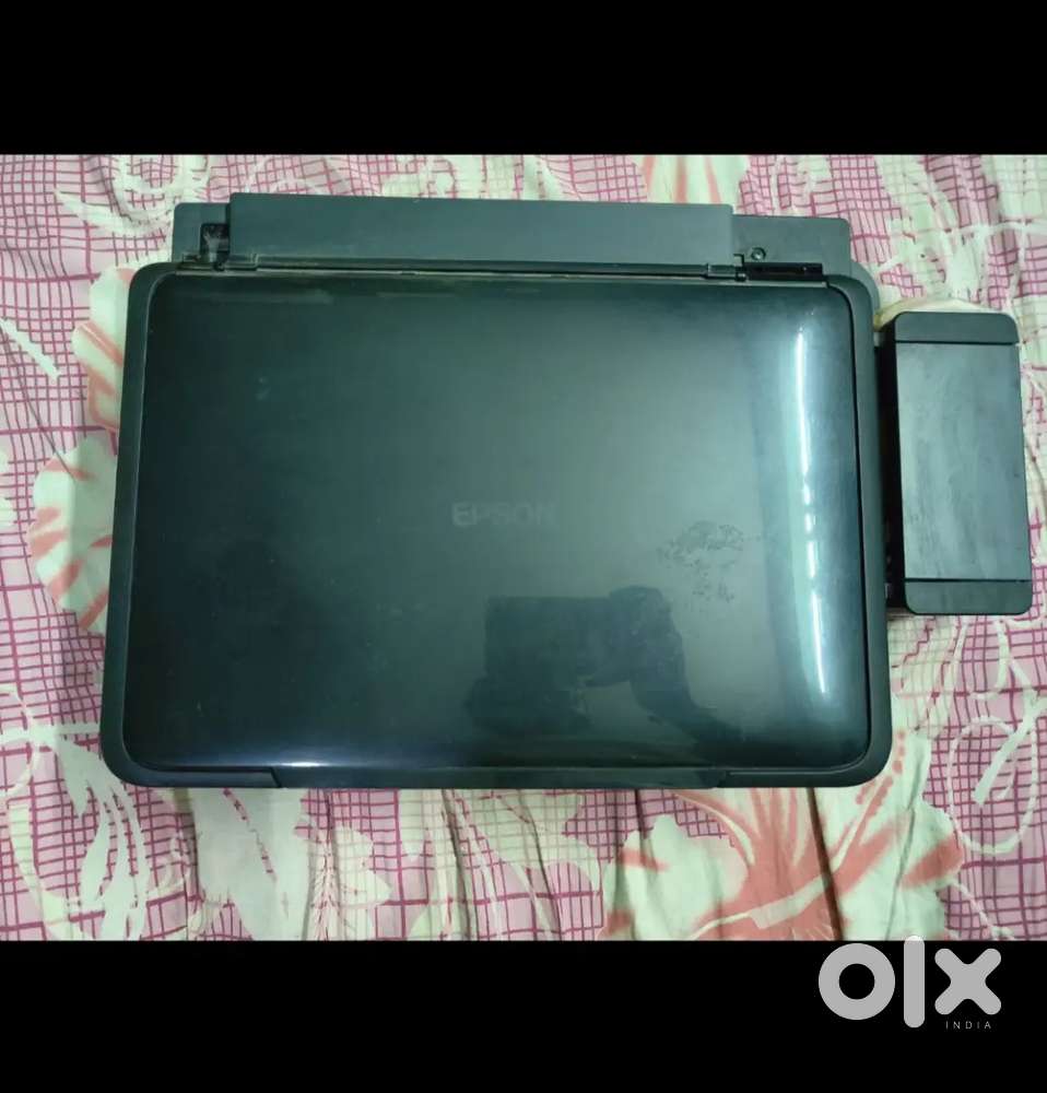 An Epson printer in almost new condition with ink