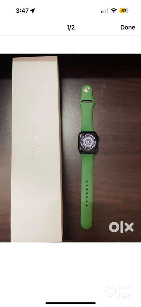 Apple series 7 smartwatch with green and blue bands at rs 10000