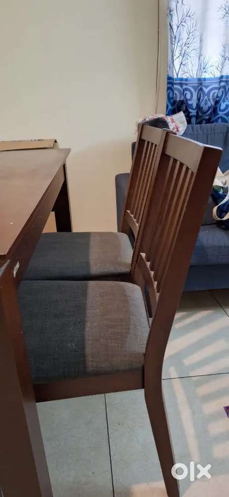 Dining table with 4 chairs from urban ladder
