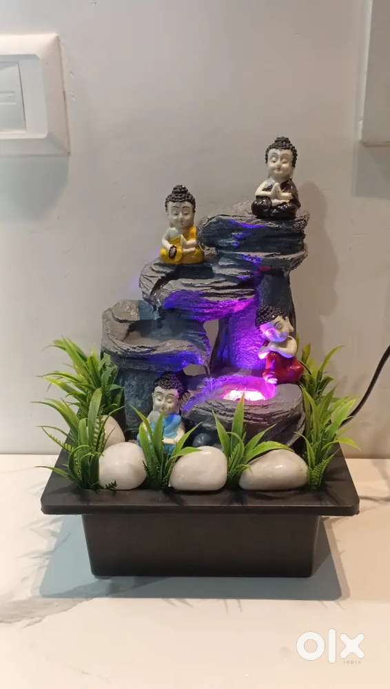 5 seater sofa,wall decor & small fountain