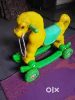 PLASTIC HORSE TOY WITH WHEELS AND SWING ALSO