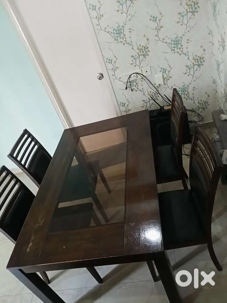 Selling 4yrs wooden dining table with four chair