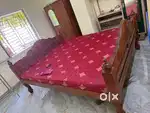 wooden bed with matress